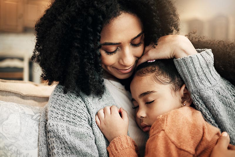 Mother Hugging Daughter